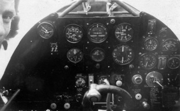 Me leaning into a Lysander cockpit.